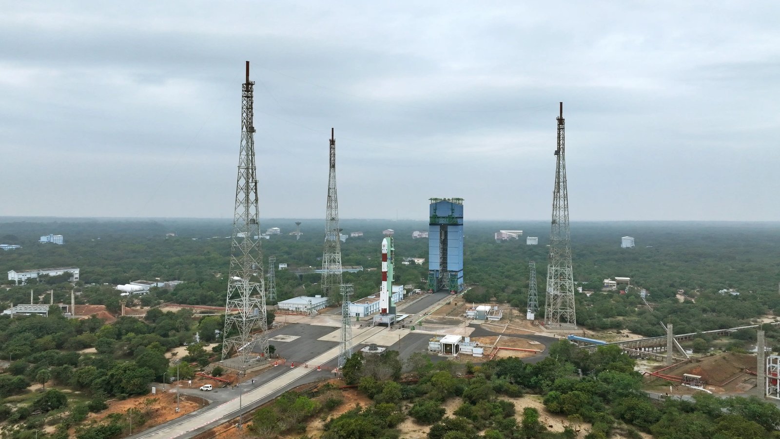 A wide view of the Sriharikota launch pads and towers, with a PSLV rocket on the pad