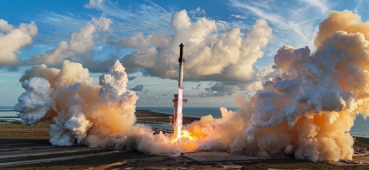 Starship climbing from its launch tower on a column of flame, with large orange-lit clouds of exhaust spreading across the ground to both sides and the coast and sea behind