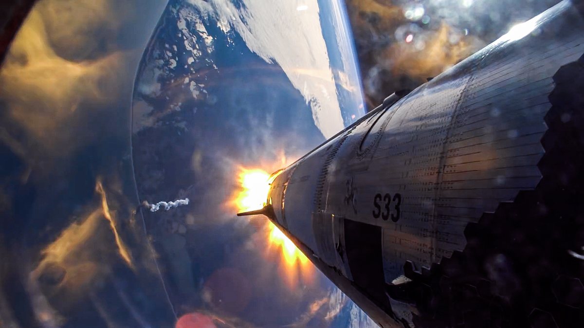 Camera view along the side of the ship, marked S33, with a bright flash at its base and the Earth far below